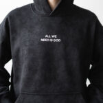чорне худі варенка з написом All we need is God