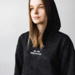 чорне худі варенка з написом All we need is God